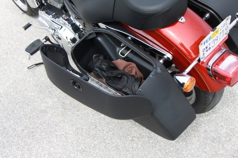 The vinyl-over-hardshell saddlebags hold a surprising amount of gear, rivaling the storage capacity of Harley's next-larger touring bike