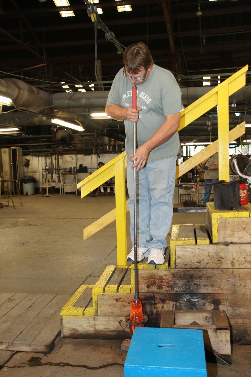 A glassblower demonstrates his craft at Blenko Glass, which produces a variety of stunning glass works